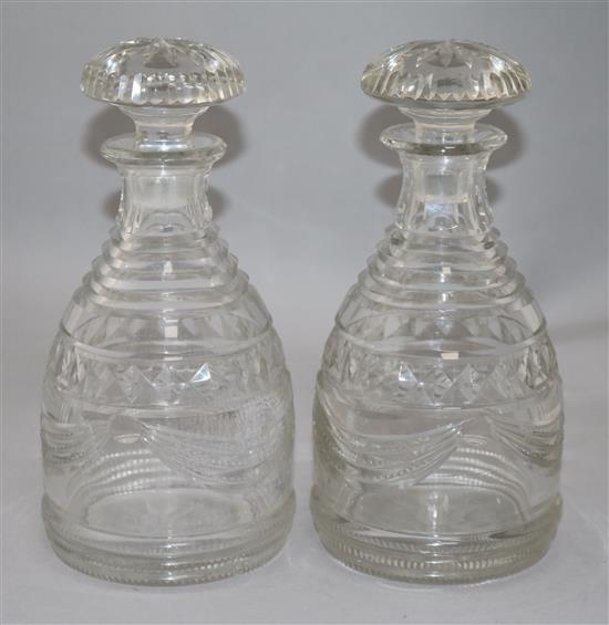 A pair of Regency Irish cut glass mallet form decanters and stoppers, height 25cm